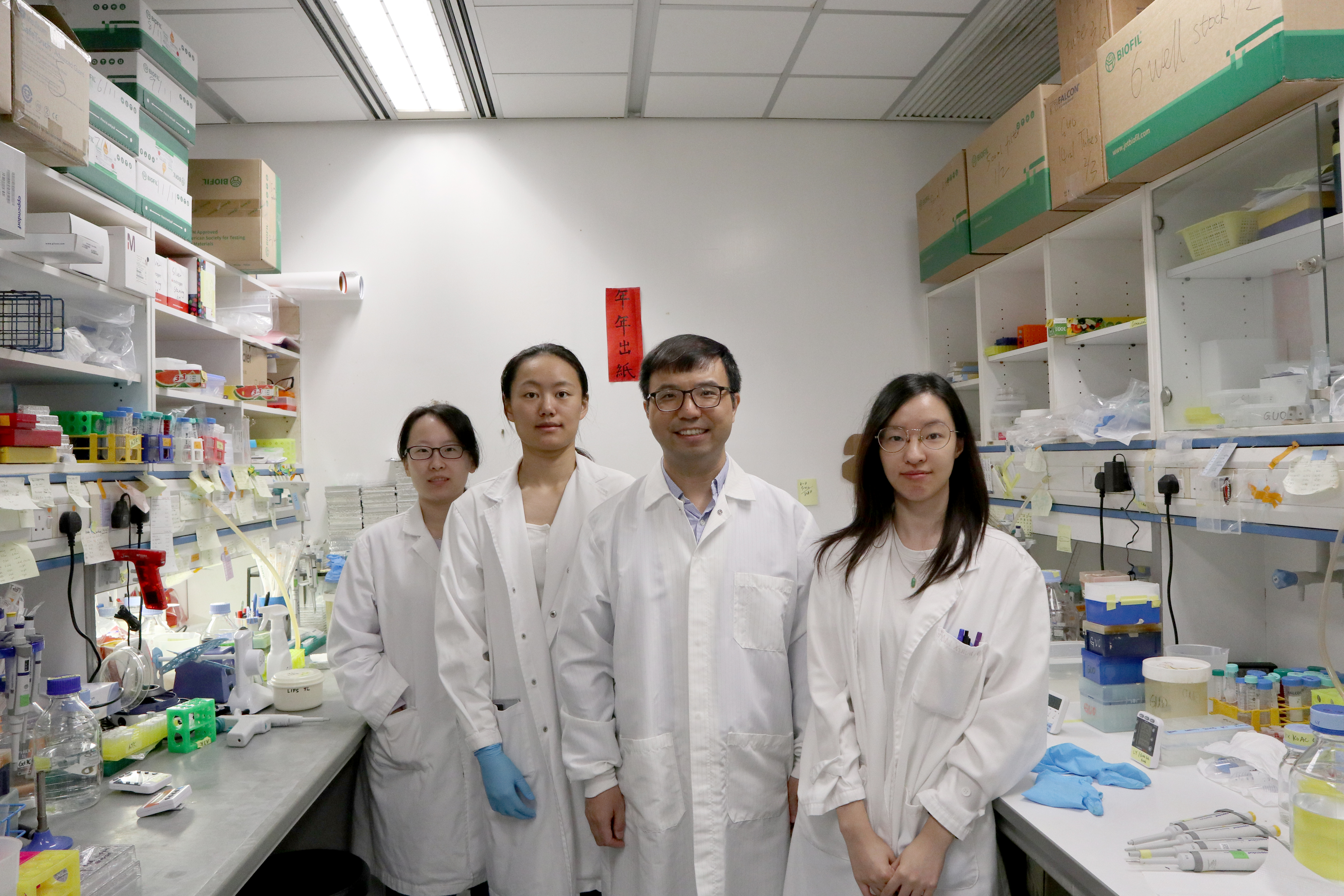 Prof. GUO Yusong (second right), Associate Professor in HKUST’s Division of Life Science, and his team members  Close