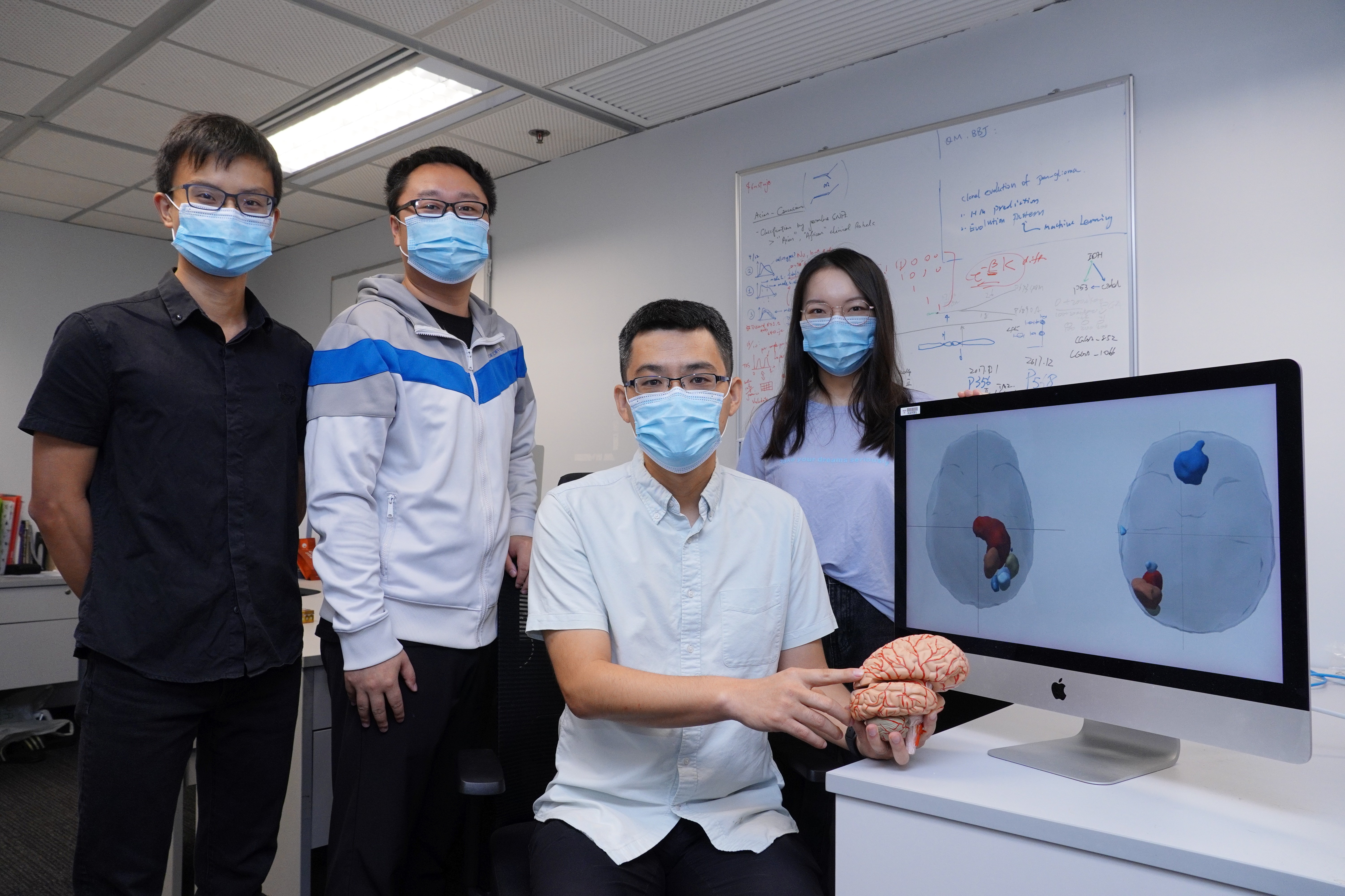 Prof. WANG Jiguang (second right) and his research team members