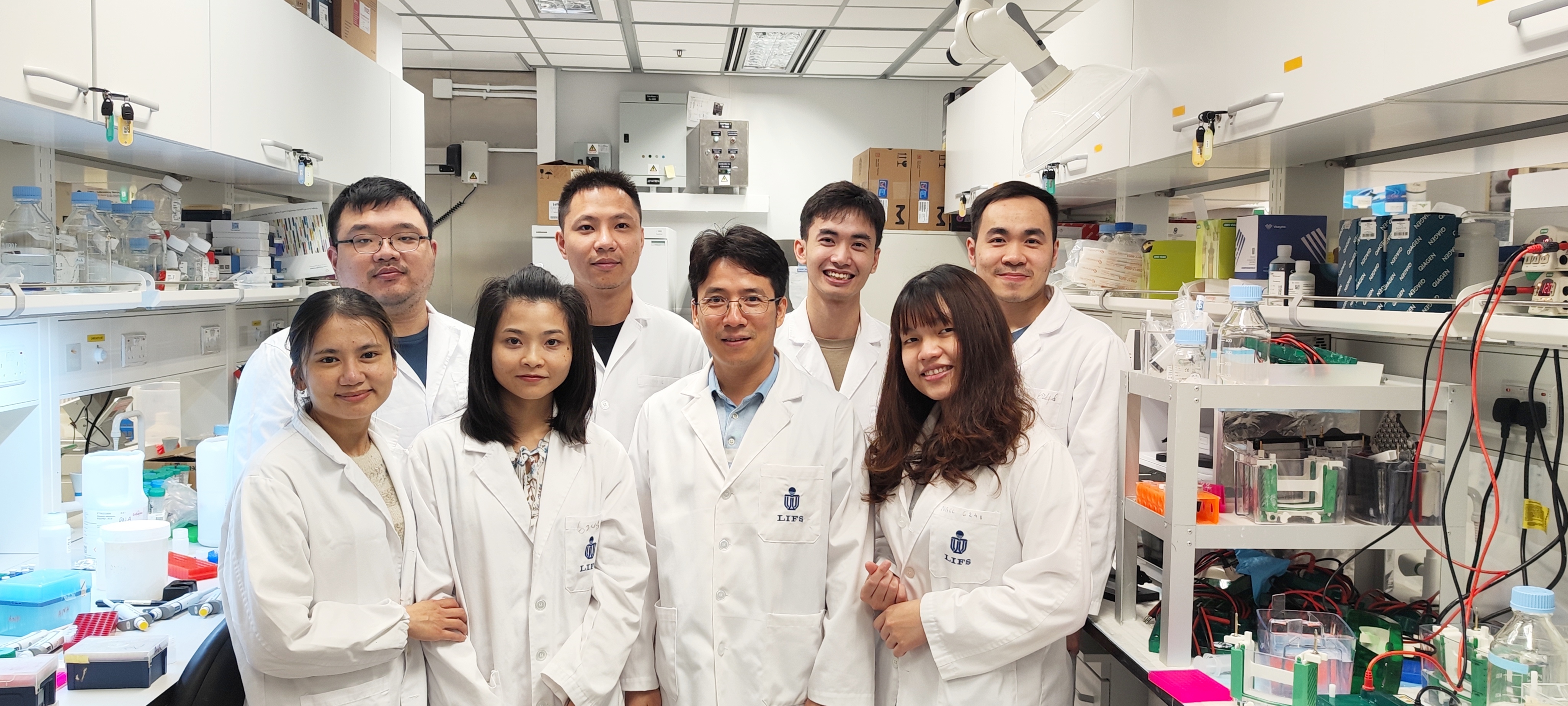 Prof. NGUYEN Tuan Anh (second right in the front row) and members of the RNA-Interacting Protein and Enzyme (RIPE) laboratory.