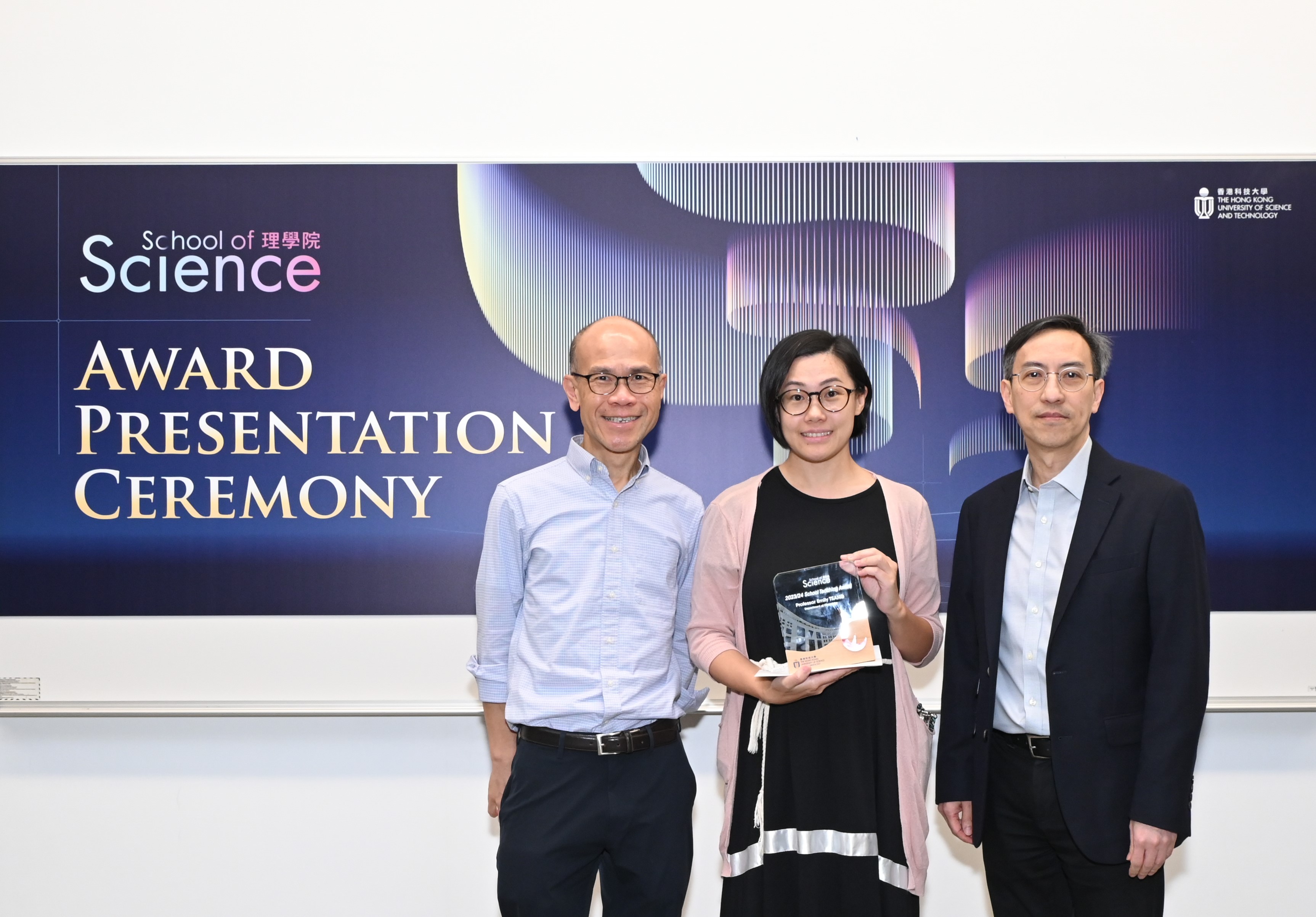 The School Teaching Award was presented to Prof. Emily Ming Wai Tsang (centre) by Prof. Yung Hou Wong, the Dean of Science (right), and greeted by Prof. Wa Hung Leung, the Acting Head of the Department of Chemistry (left).  