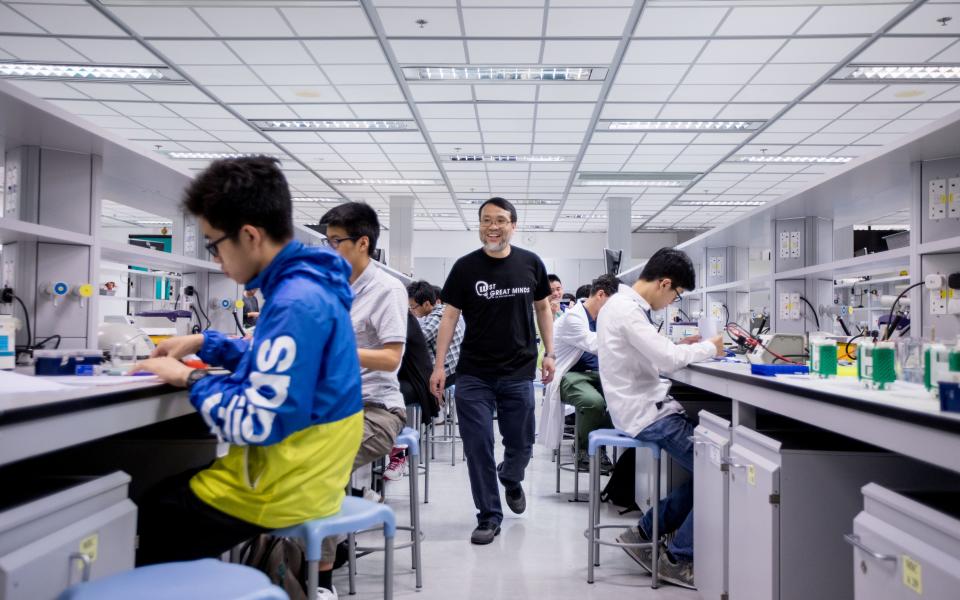 Prof. King Chow (Middle) wants to change the way biology is being taught and perceived in local schools by bringing in the International Biology Olympiad.