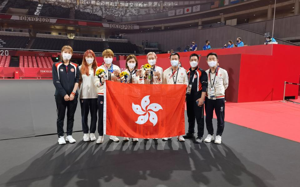 Minnie Soo (fourth right) and her teammates Lee Ho-Ching (fourth left) and Doo Hoi-Kem (third left) win bronze in the Table Tennis Women’s Team competition of the Tokyo 2020 Olympic Games.