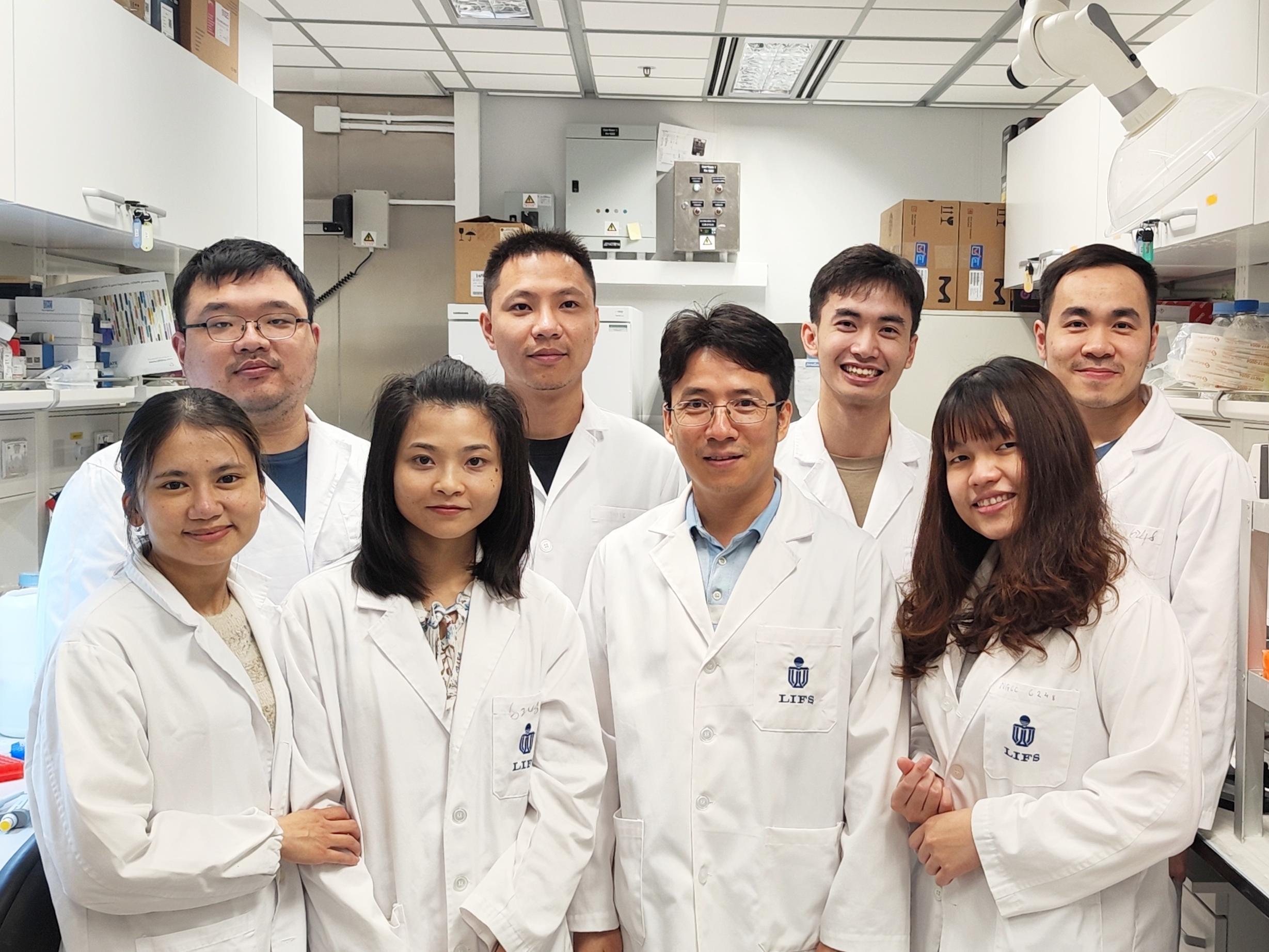 Prof. NGUYEN Tuan Anh (second right in the front row) and members of the RNA-Interacting Protein and Enzyme (RIPE) laboratory.