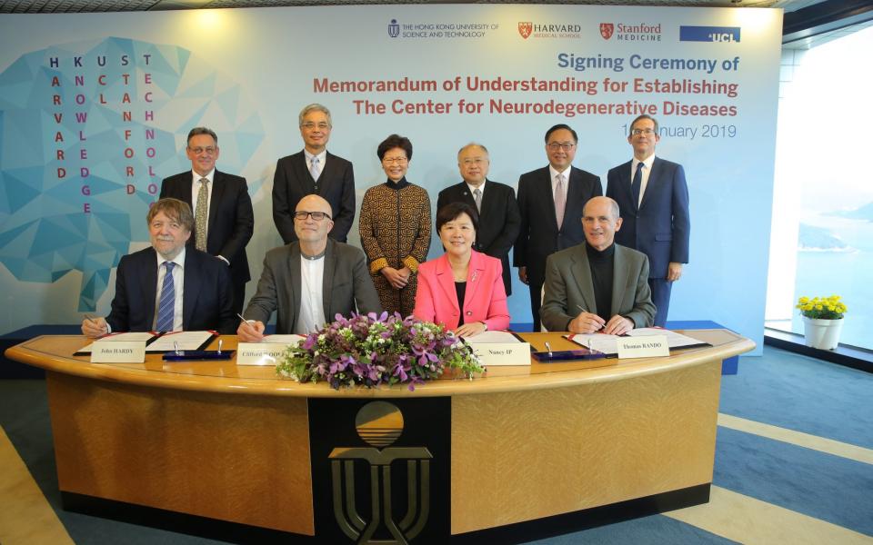 The Hon Mrs. Carrie LAM (back third left), Chief Executive of HKSAR; Mr. Andrew LIAO (back third right), HKUST Council Chairman; Prof. Wei SHYY (back second left), HKUST President; Mr. Nicholas W YANG (back second right), Secretary for Innovation and Technology; Mr. Andrew HEYN (back first left), British Consul General in Hong Kong and Mr. Thomas HODGES (back first right), Acting U.S. Consul General in Hong Kong witness the MoU signing between Prof. Nancy IP (front second right), HKUST Vice-President for Re